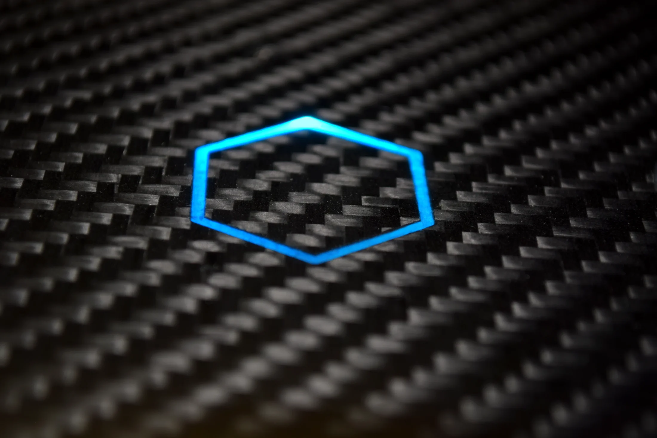 Carbon fiber smart surface with illuminated touch sensor