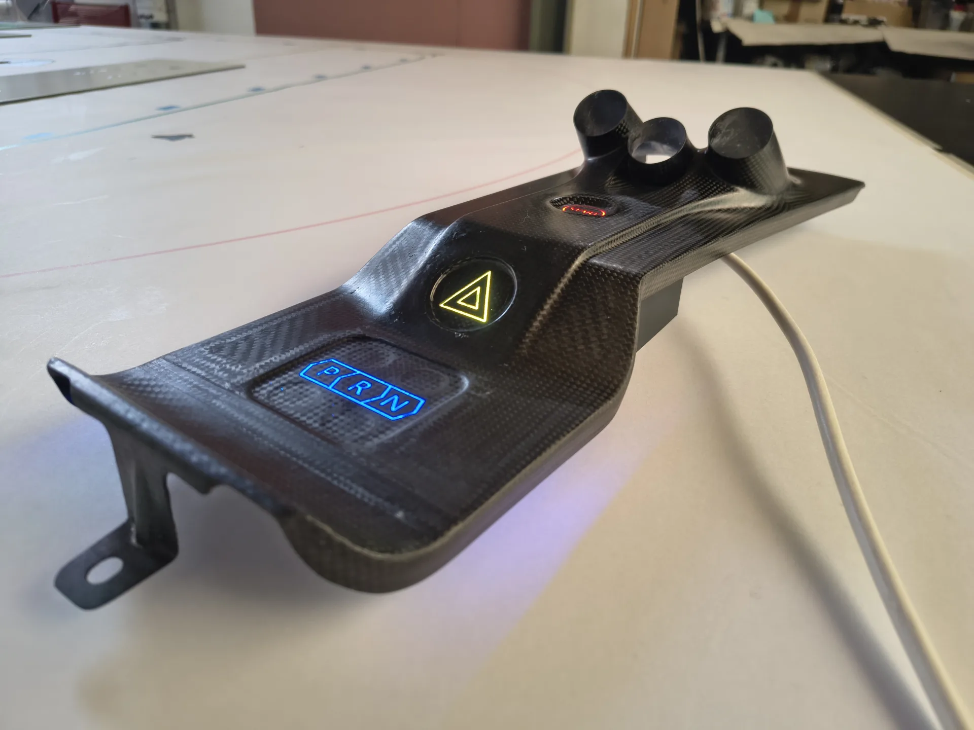 Carbon fiber structural component with integrated smart buttons